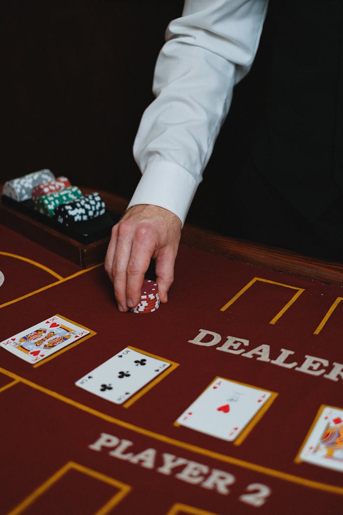 Elegant setup of a casino blackjack table with a dealer handling chips, perfect for gambling themes.